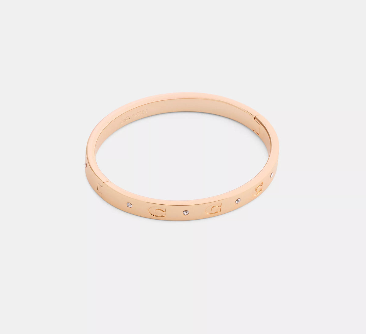Coach Repeated C Hinged Bangle  -  Rose Gold